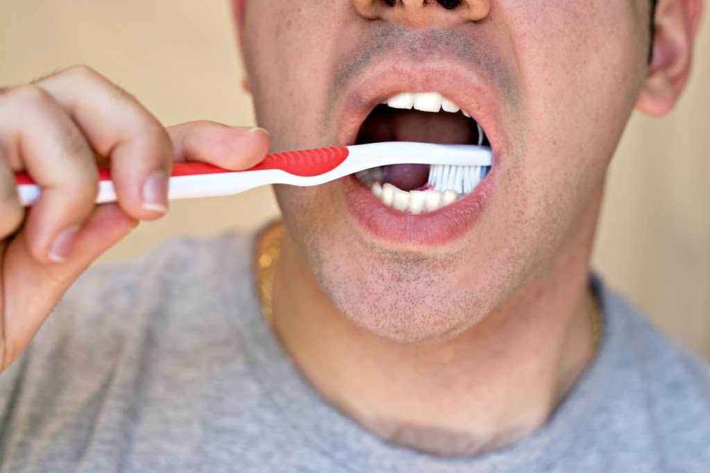 Man Brushing His Teeth
