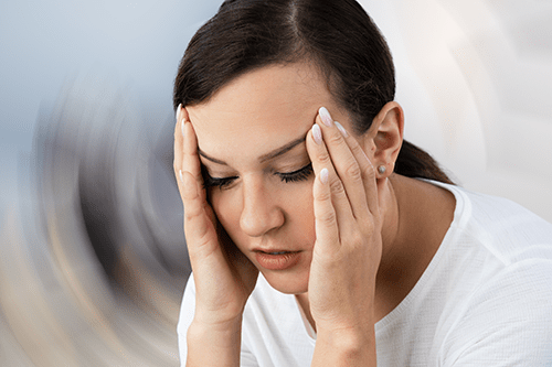 Woman suffering from balance disorders