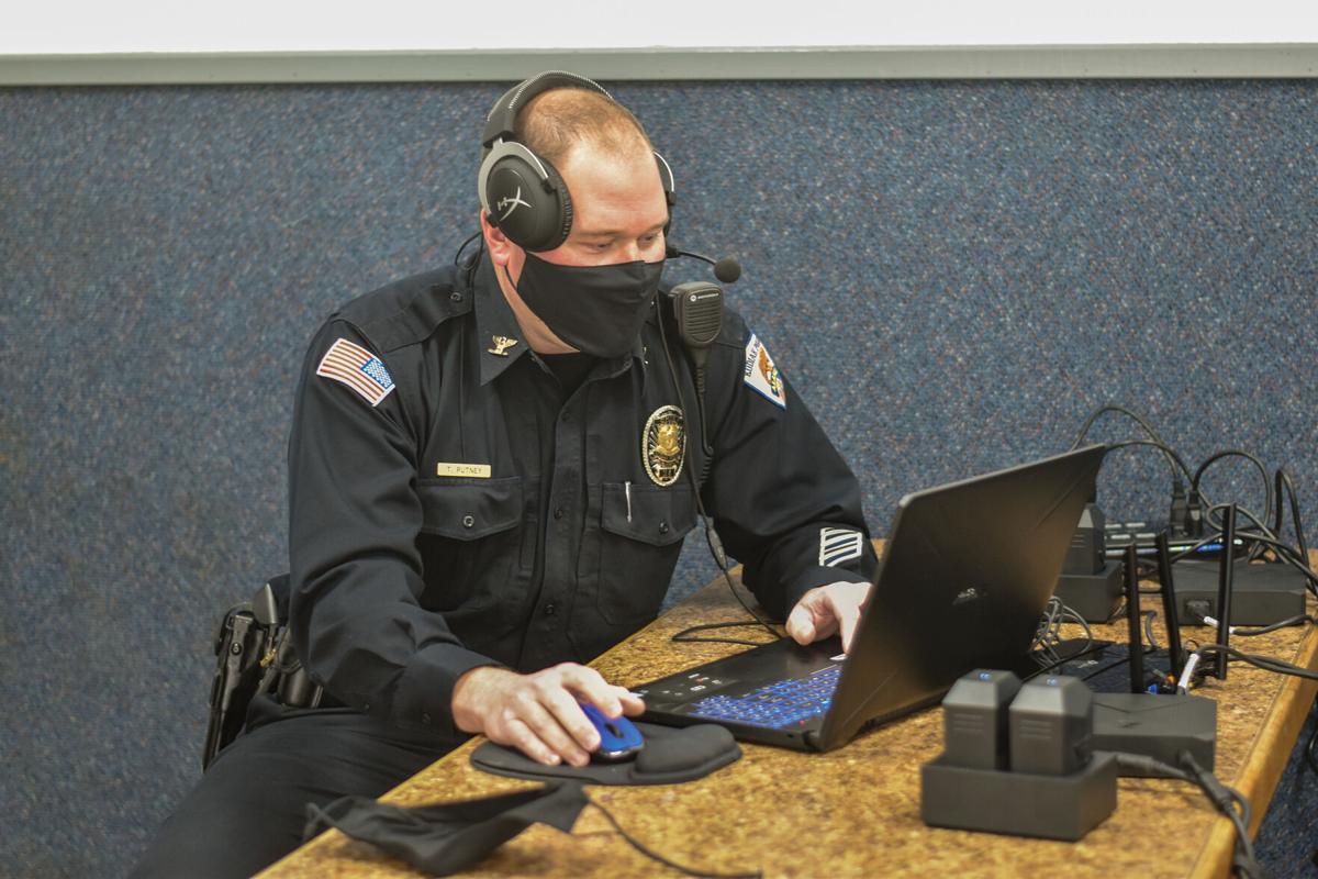 Kodiak Police Chief Tim Putney controls the Apex Officer training scenario from his instructor control center