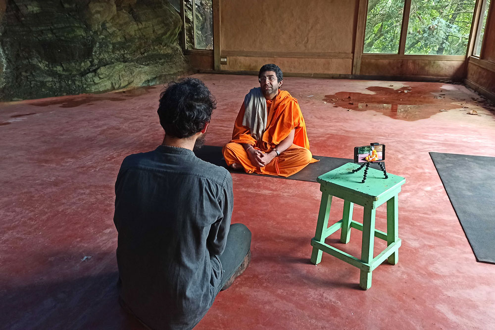 man interviewing a Krishna monk