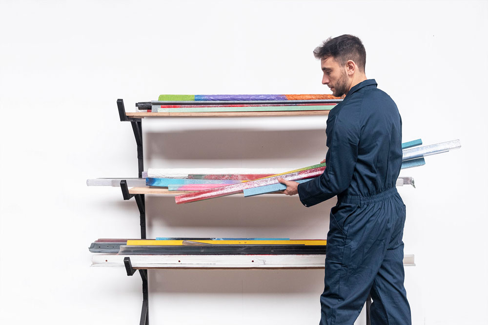 man handling recycled beams