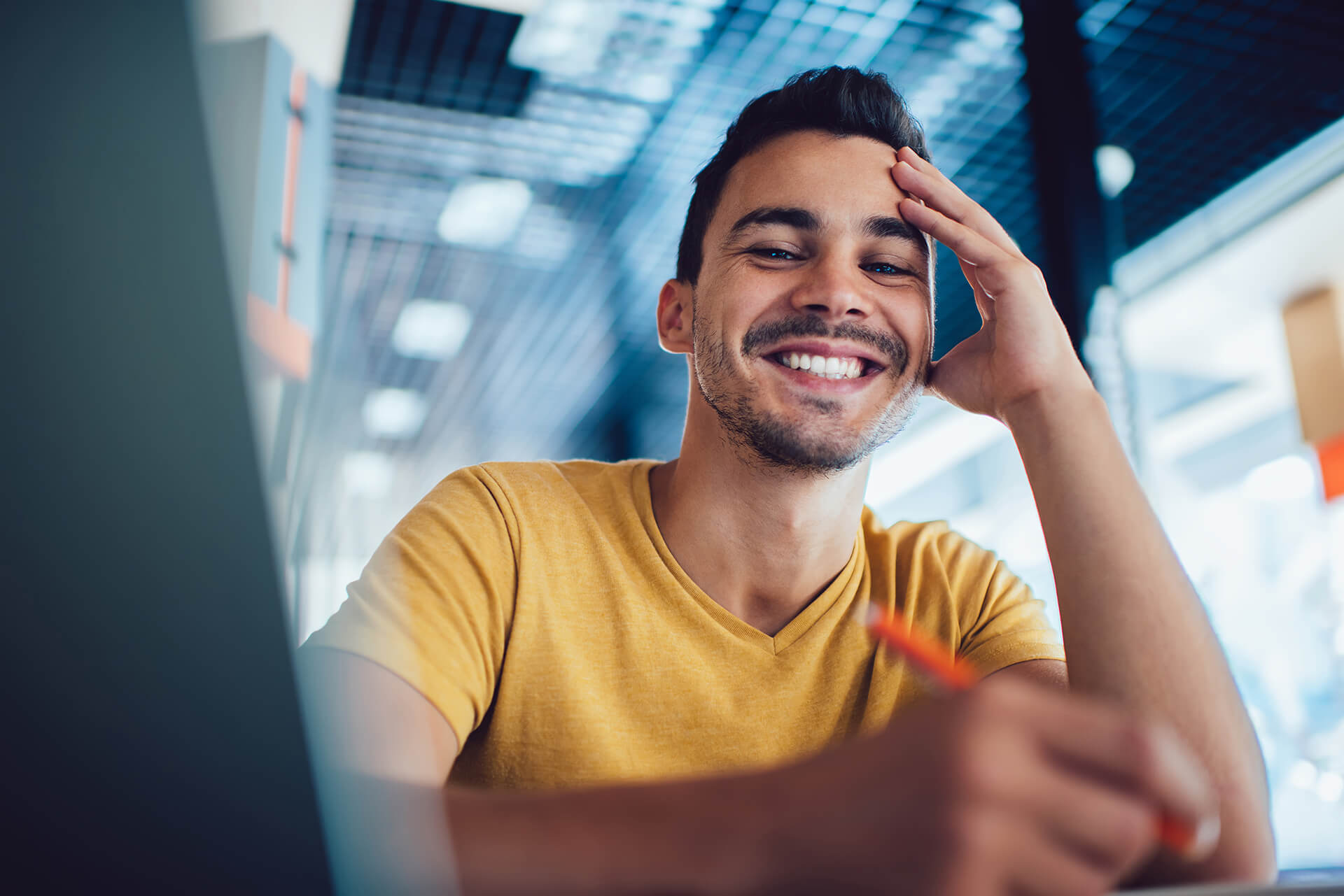 Young Man behind a Laptop. Portrait.