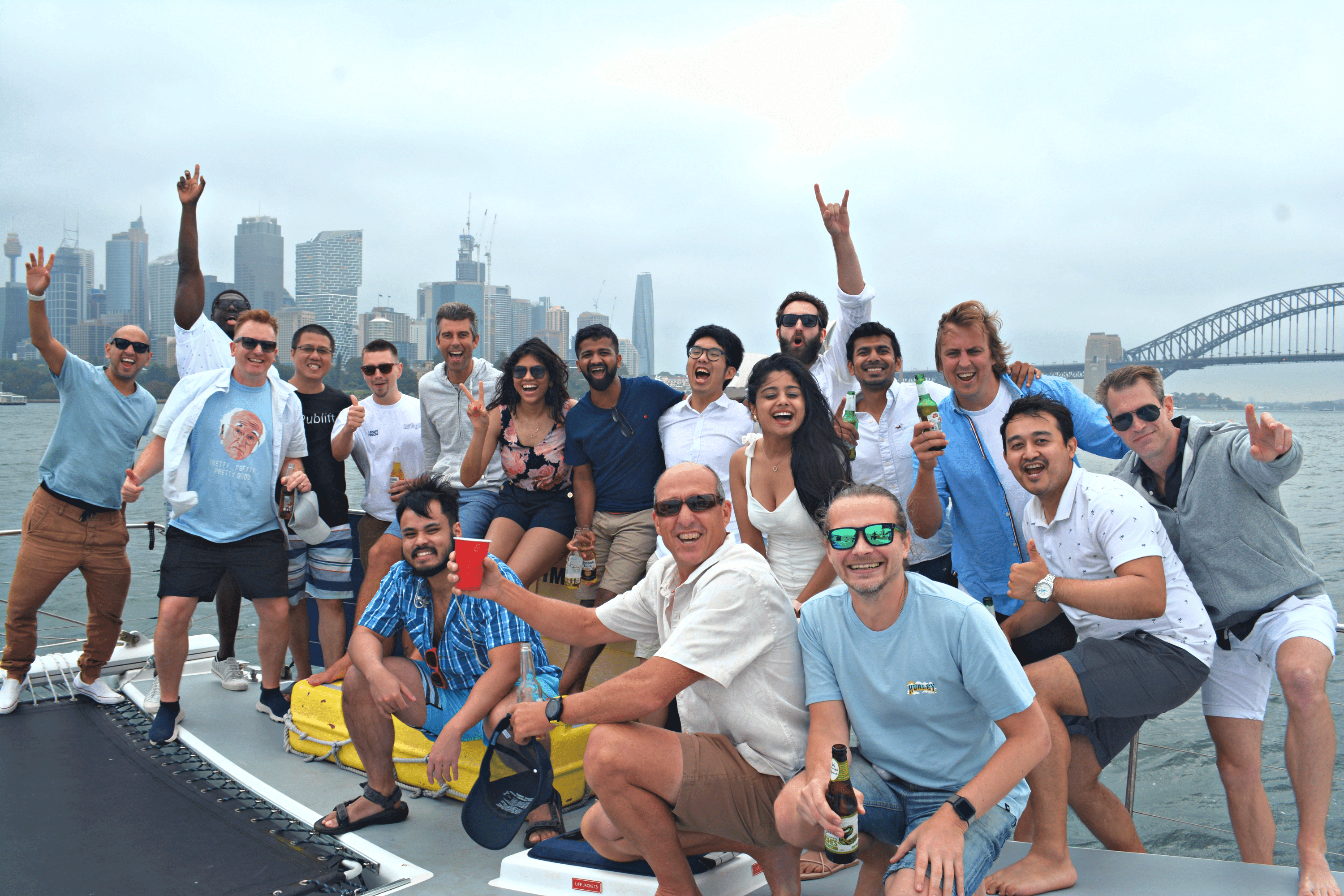 A group of people smiling on a boat