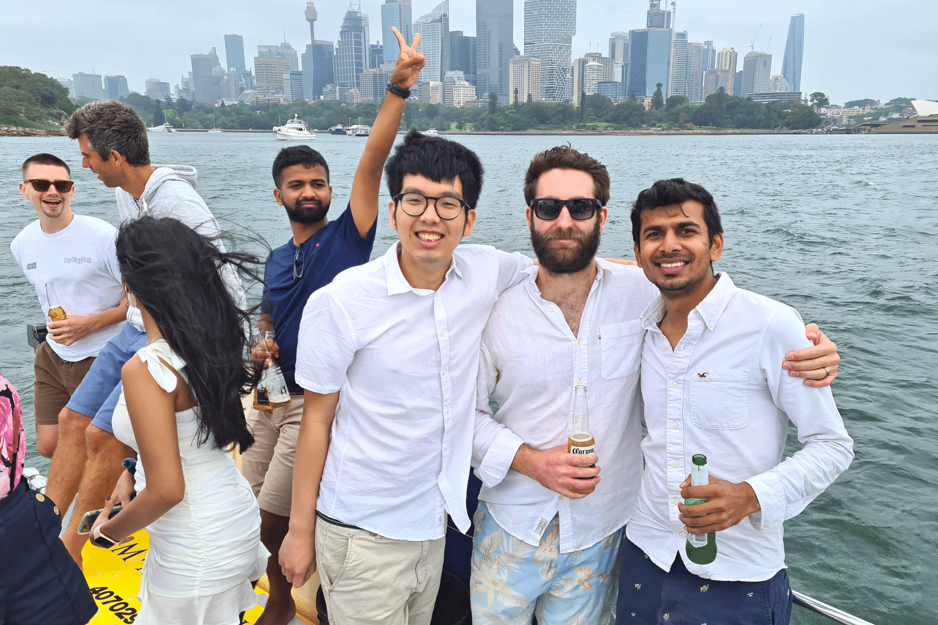 A group of people smiling on a boat