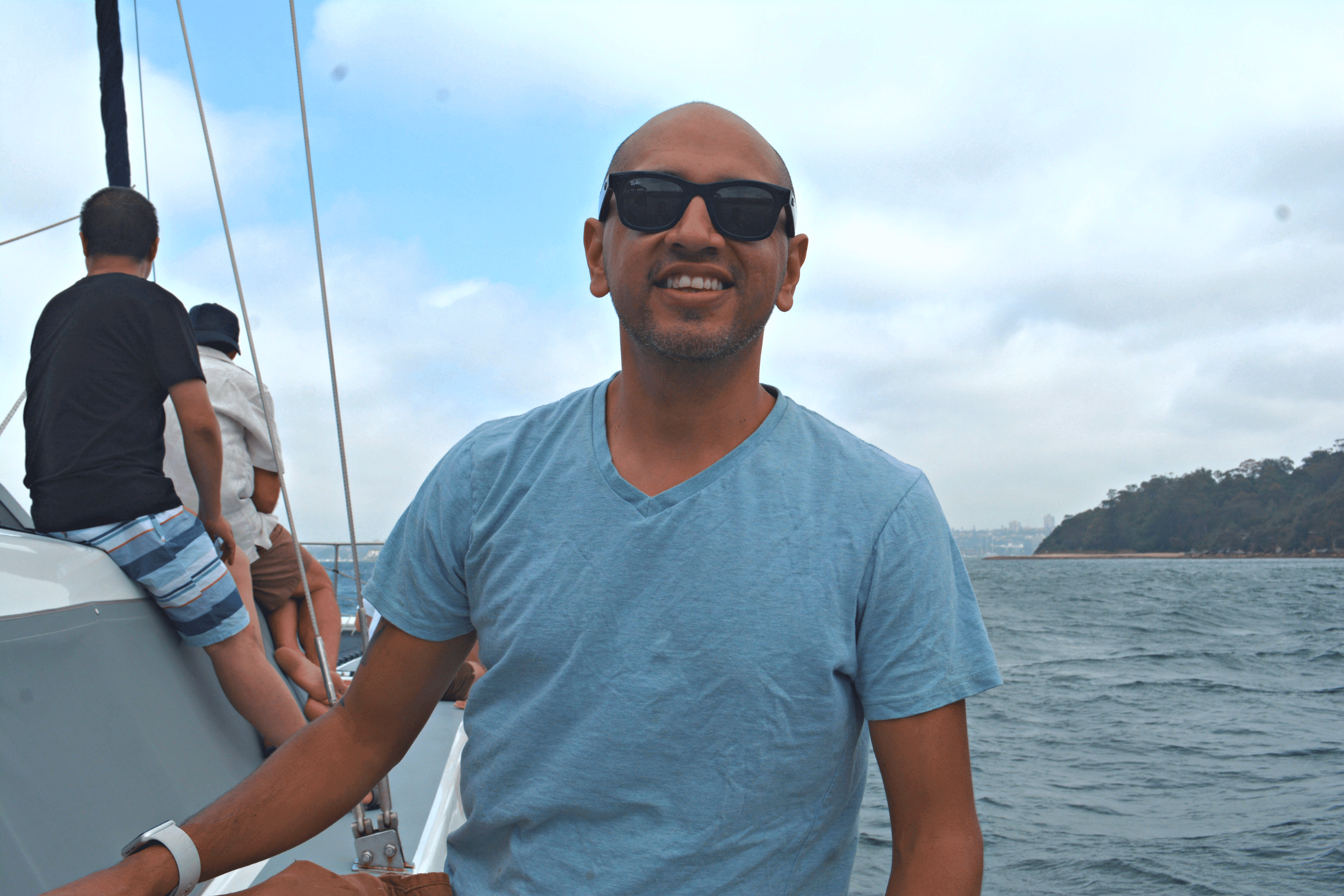 A man smiling on a boat