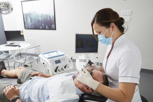 Dentist scanning patients mouth with camera