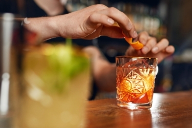 Bar tender serving a cocktail
