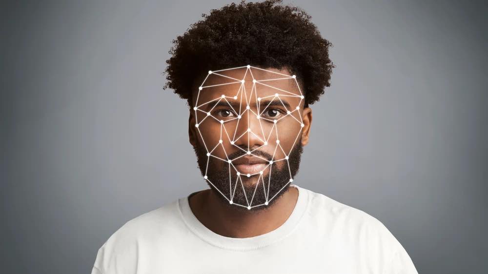 Man's face overlaid with data points