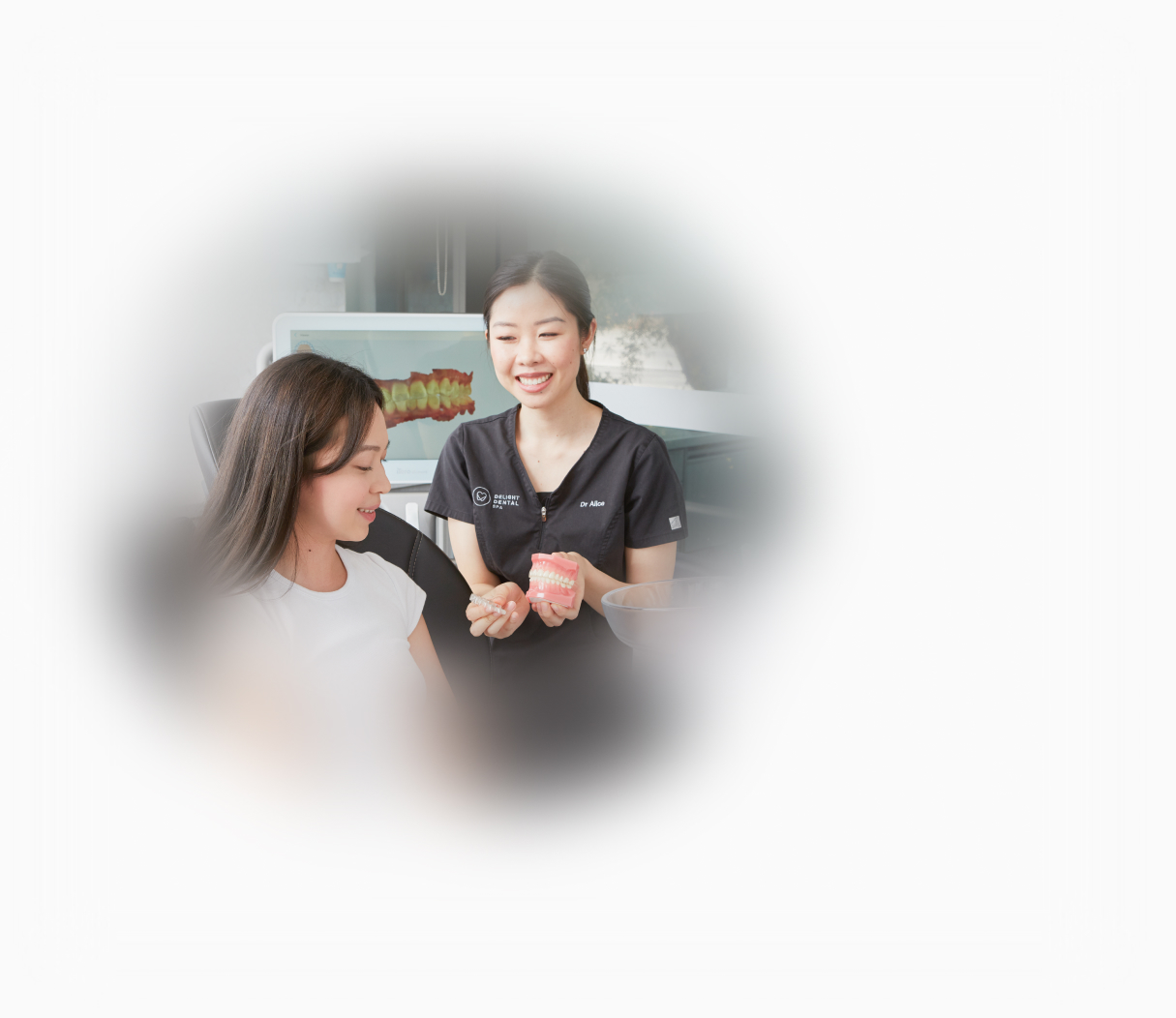 dr alice showing a patient invisalign aligners