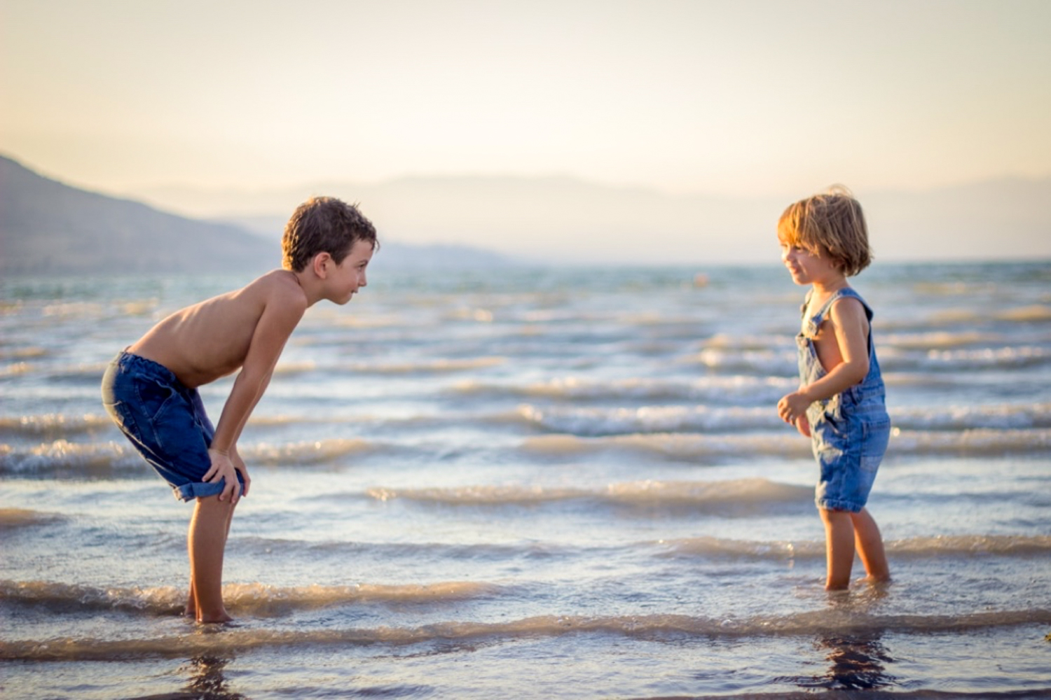 Two kids playing in the sea