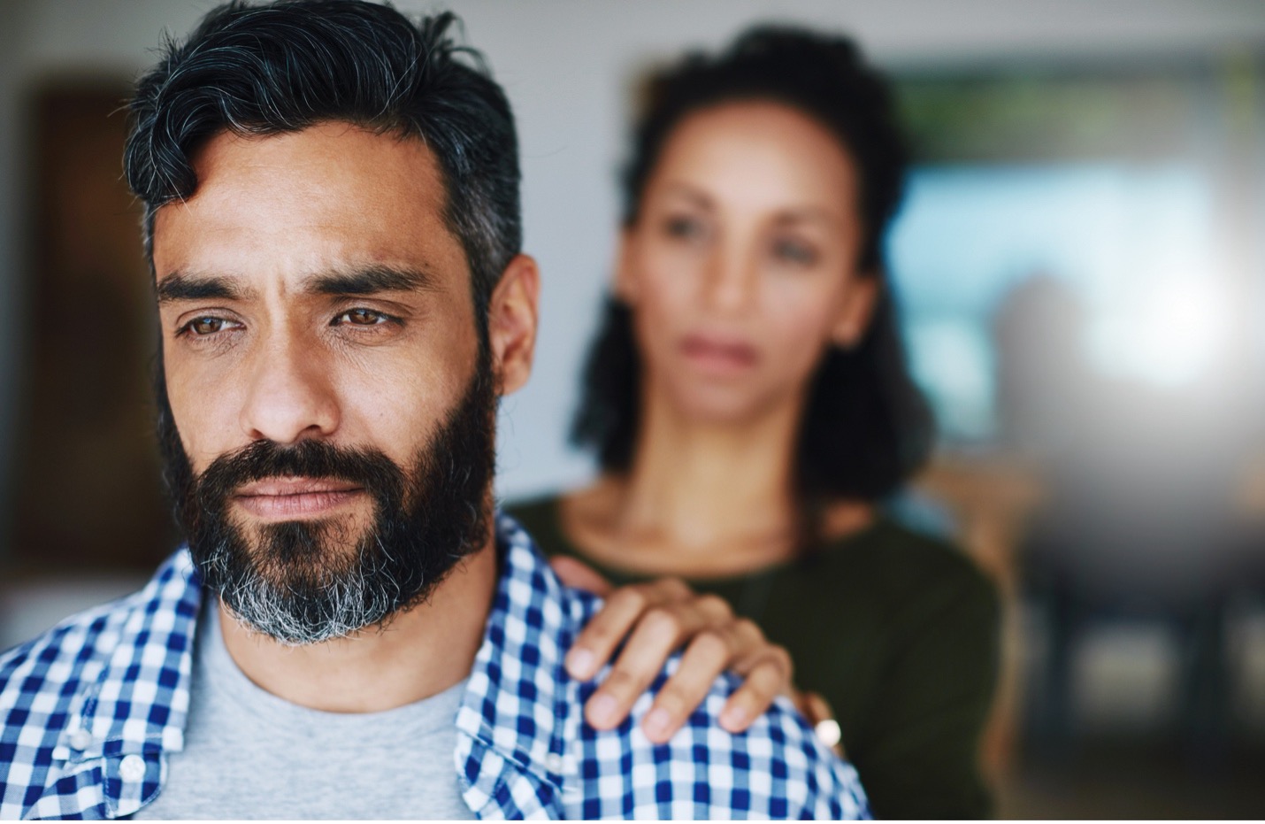 Man getting comfort from a women