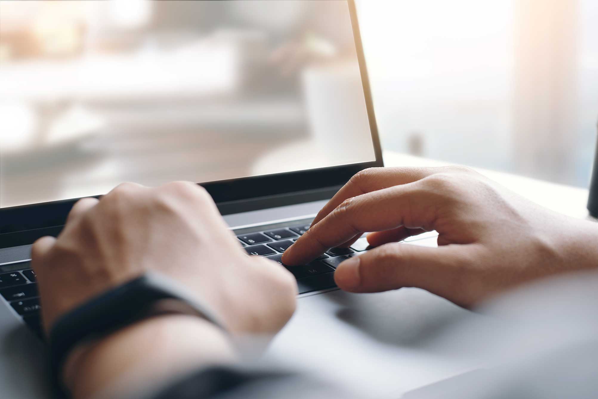 Person doing research of divorce lawyers on their laptop