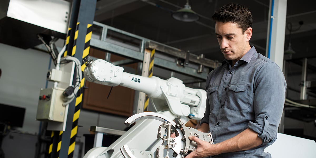 Man working with technical machinery.