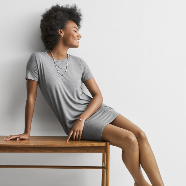 Young woman wearing a gray Express t-shirt dress