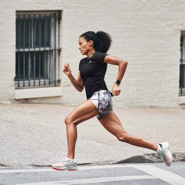 Young woman running wearing Under Armour clothing