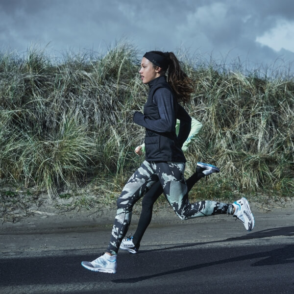 Young women running in Under Armour athletic wear
