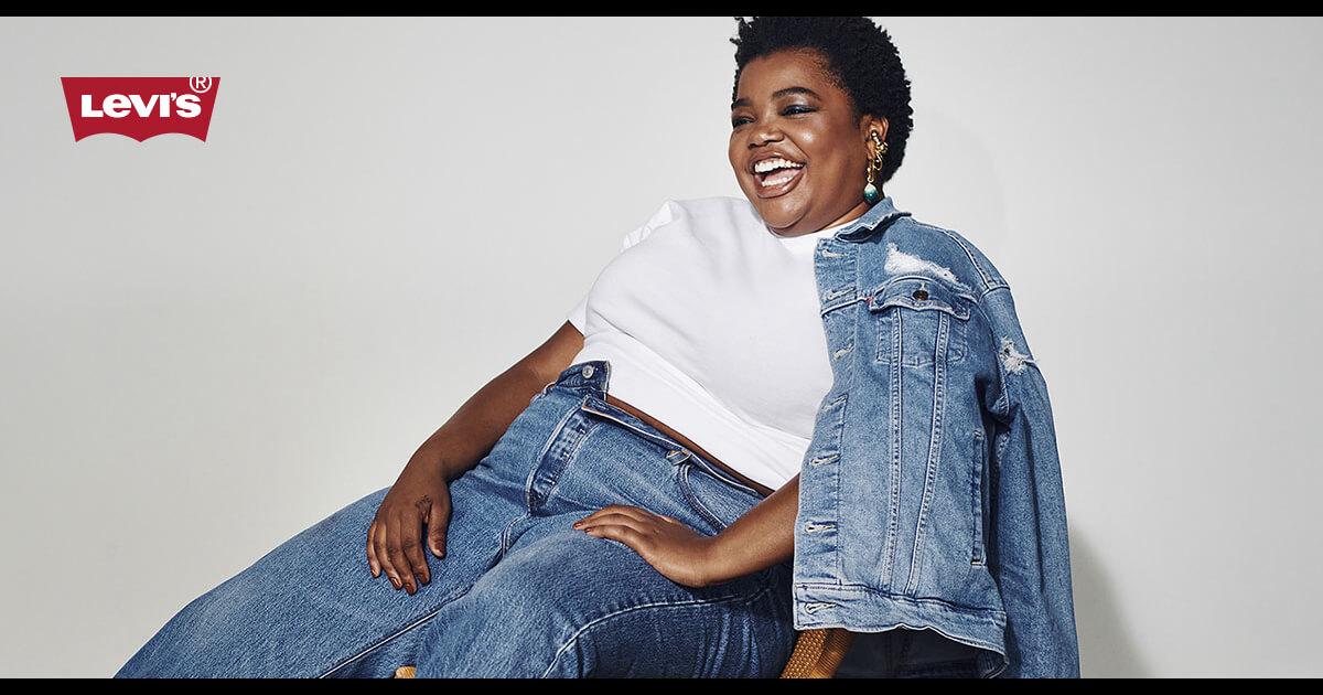 Model wearing Levi's white tee and denim jacket and jeans