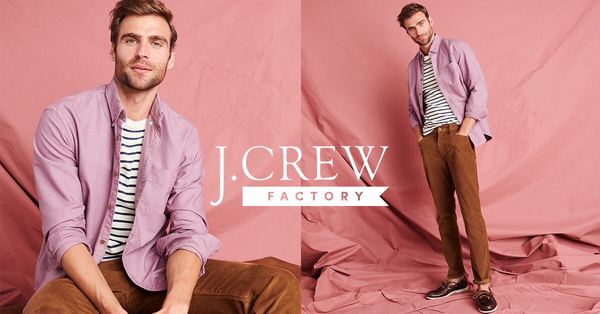 Model wearing pink J. Crew button-up shirt over black and white striped shirt and brown pants