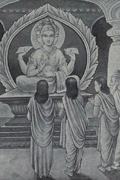 people standing around looking at a statue of Buddha