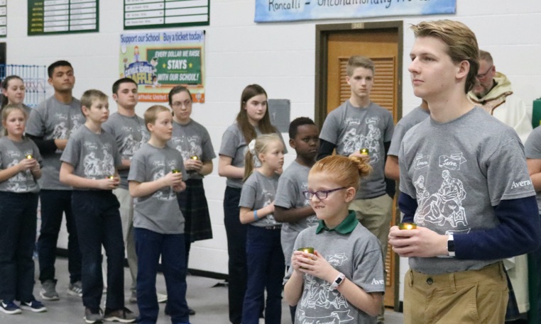 roncalli students at mass in gym