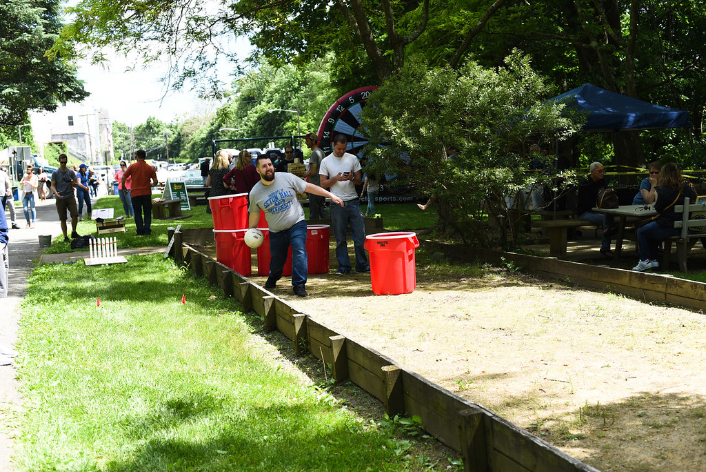 man playing a lawn game at a past Boonton Brewfest event