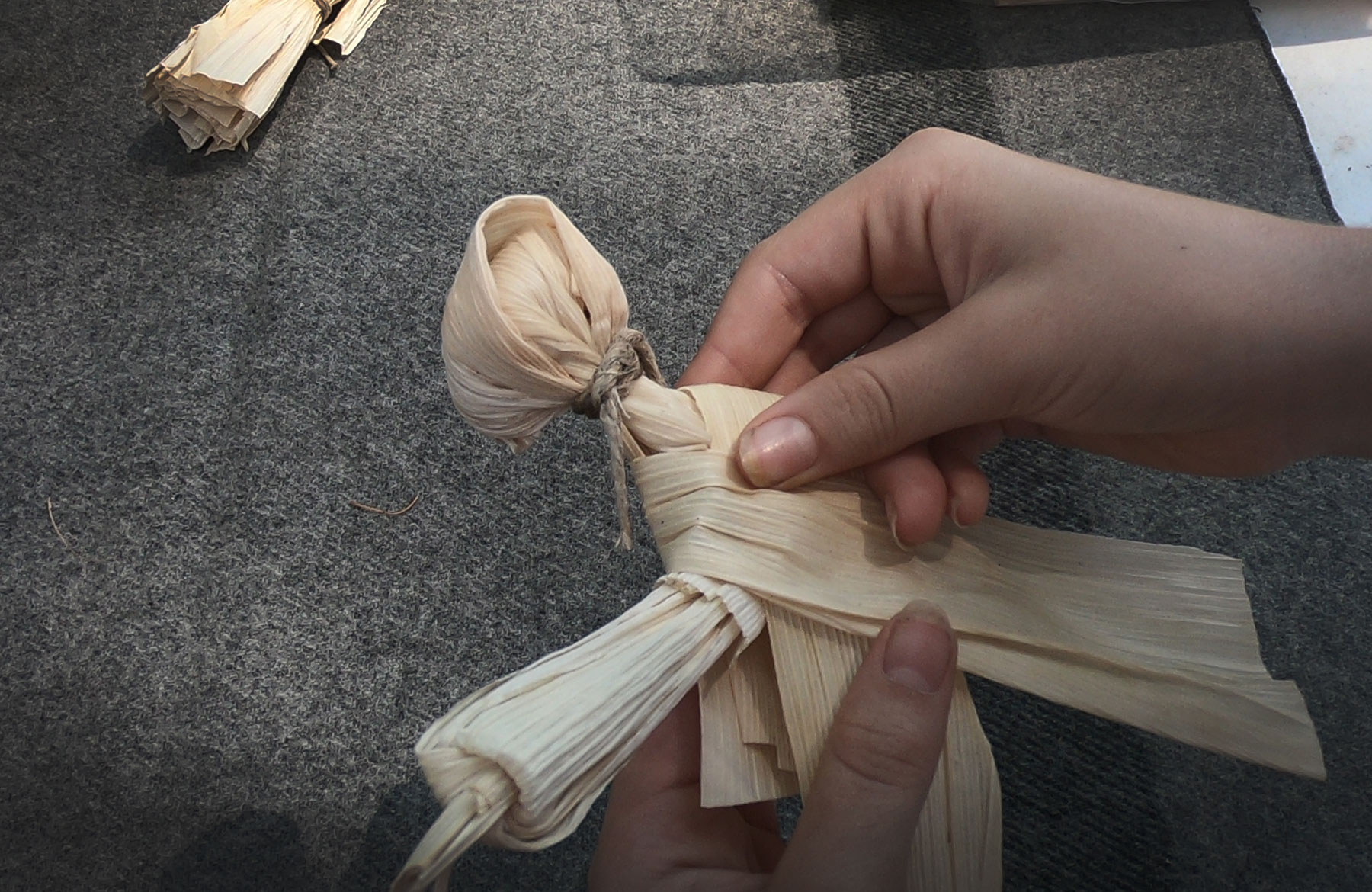 Making a cornhusk doll as part of the living history program Monument atChickamauga and Chattanooga National Military Park, Georgia