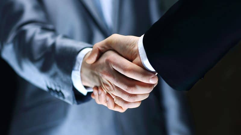 two men shaking hands