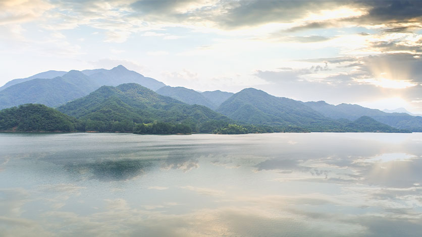 Peaceful lake surrounded by mountains may be the perfect place to have your cremated ashes scattered