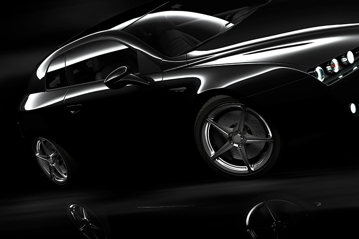 Carro de luxo preto em ambiente escuro com luzes refletindo em sua lataria e mostrando as linhas de seu design