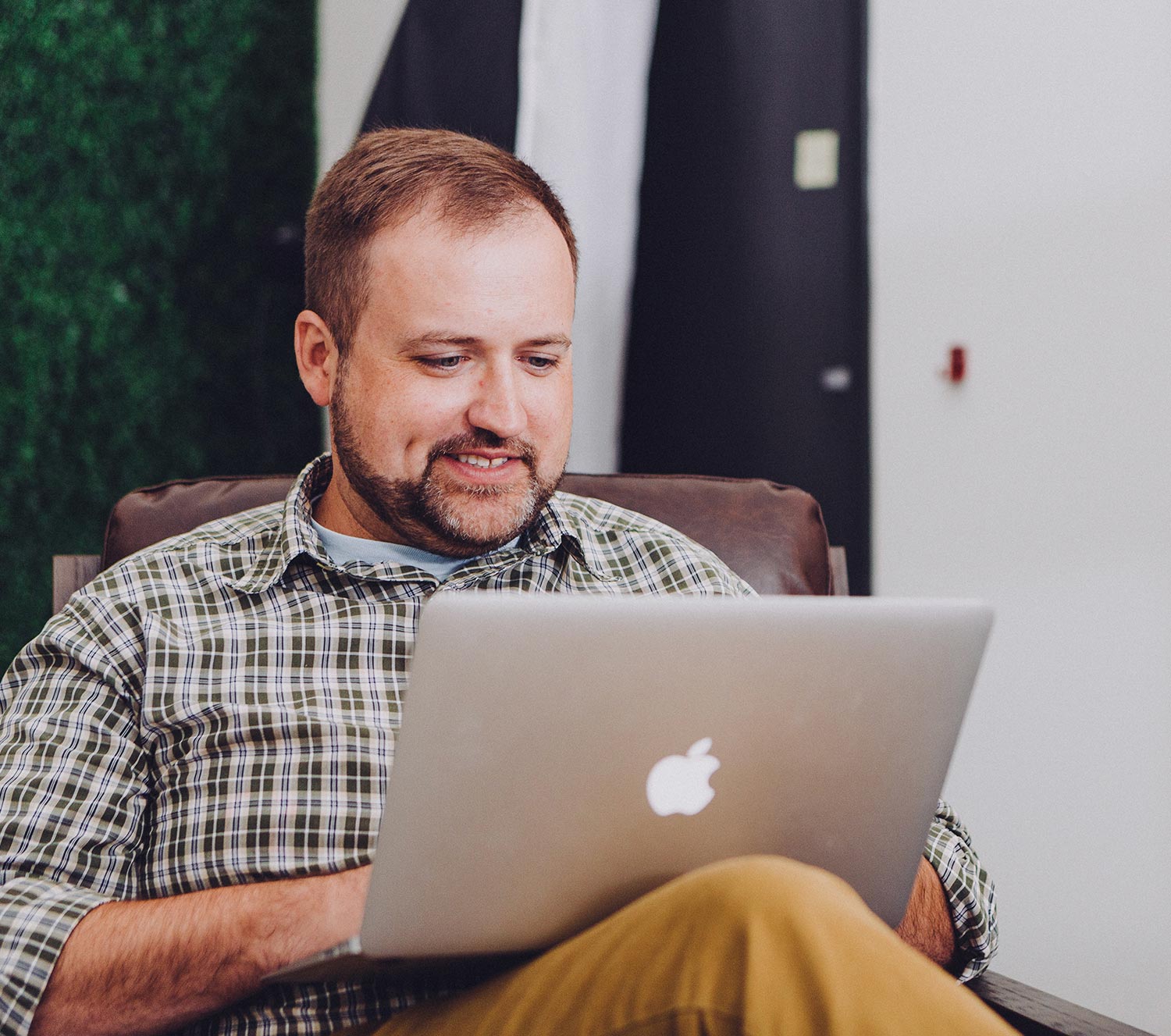 Man learning on his computer via the Guide platform