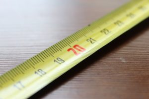 Tape measure on a wooden surface