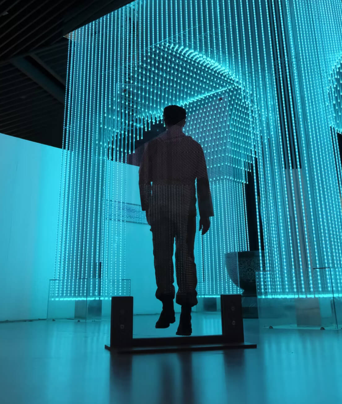 Man in blue room.
