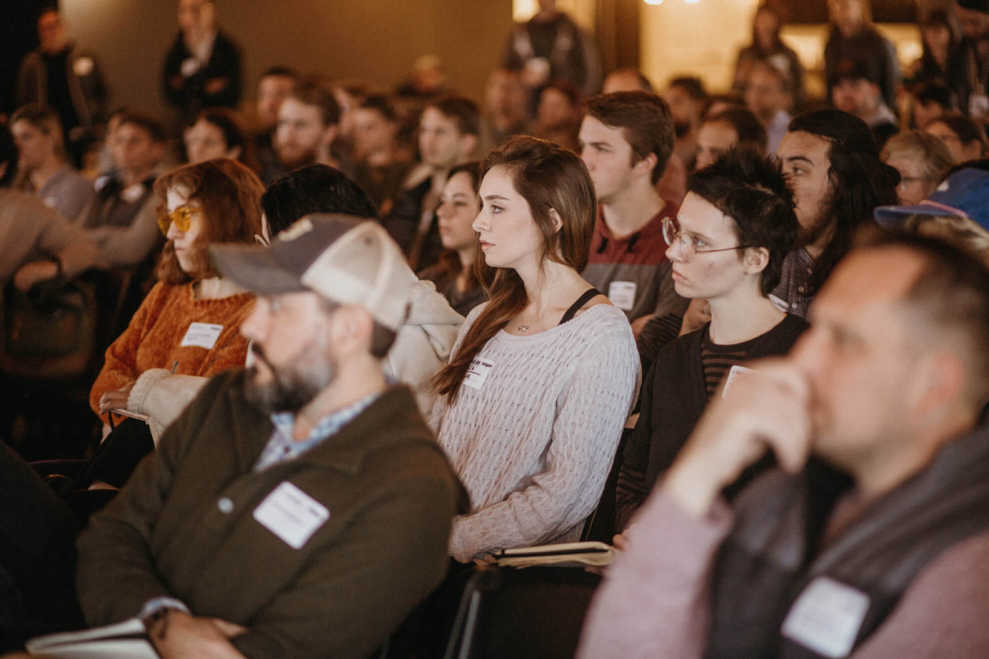 An audience listening to a speaker at Creative Mornings in Chattanooga.