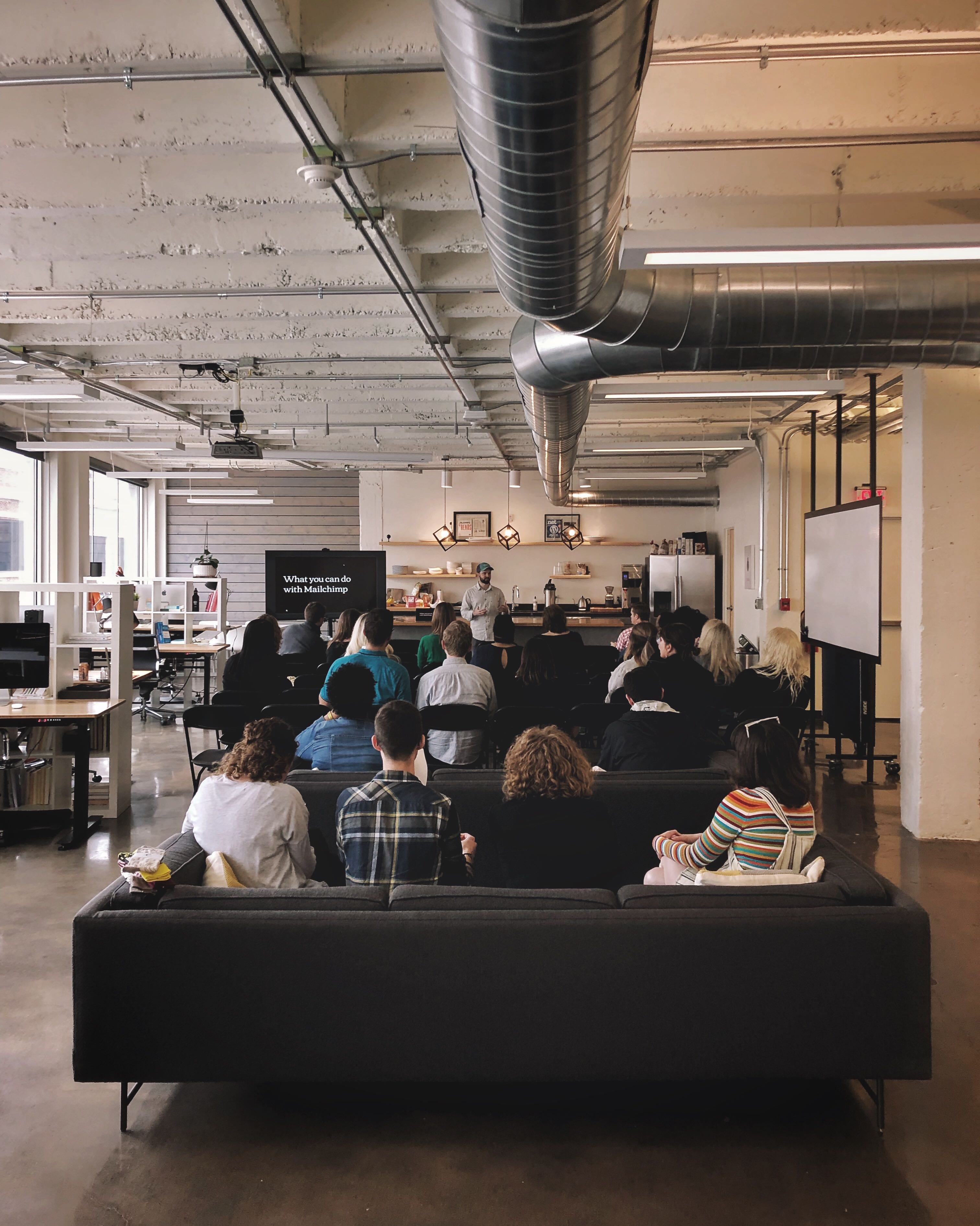 Nick Blackmon, director of Marketing, leads a Mailchimp gathering at the Whiteboard office.
