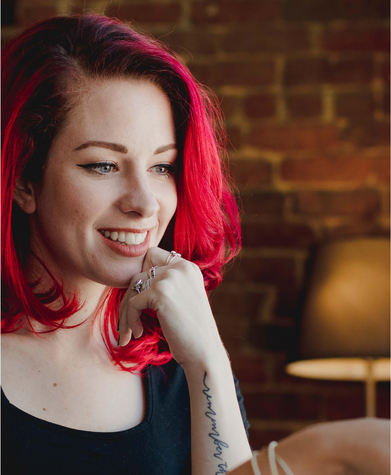 Whiteboard employee Savannah Wallace smiles while working in the office.