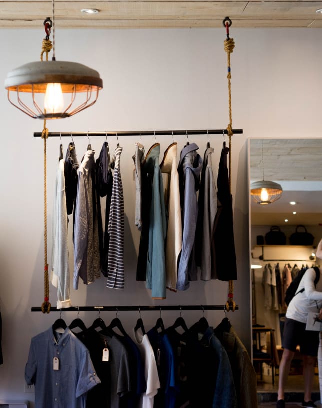 A rack of hanging clothes.