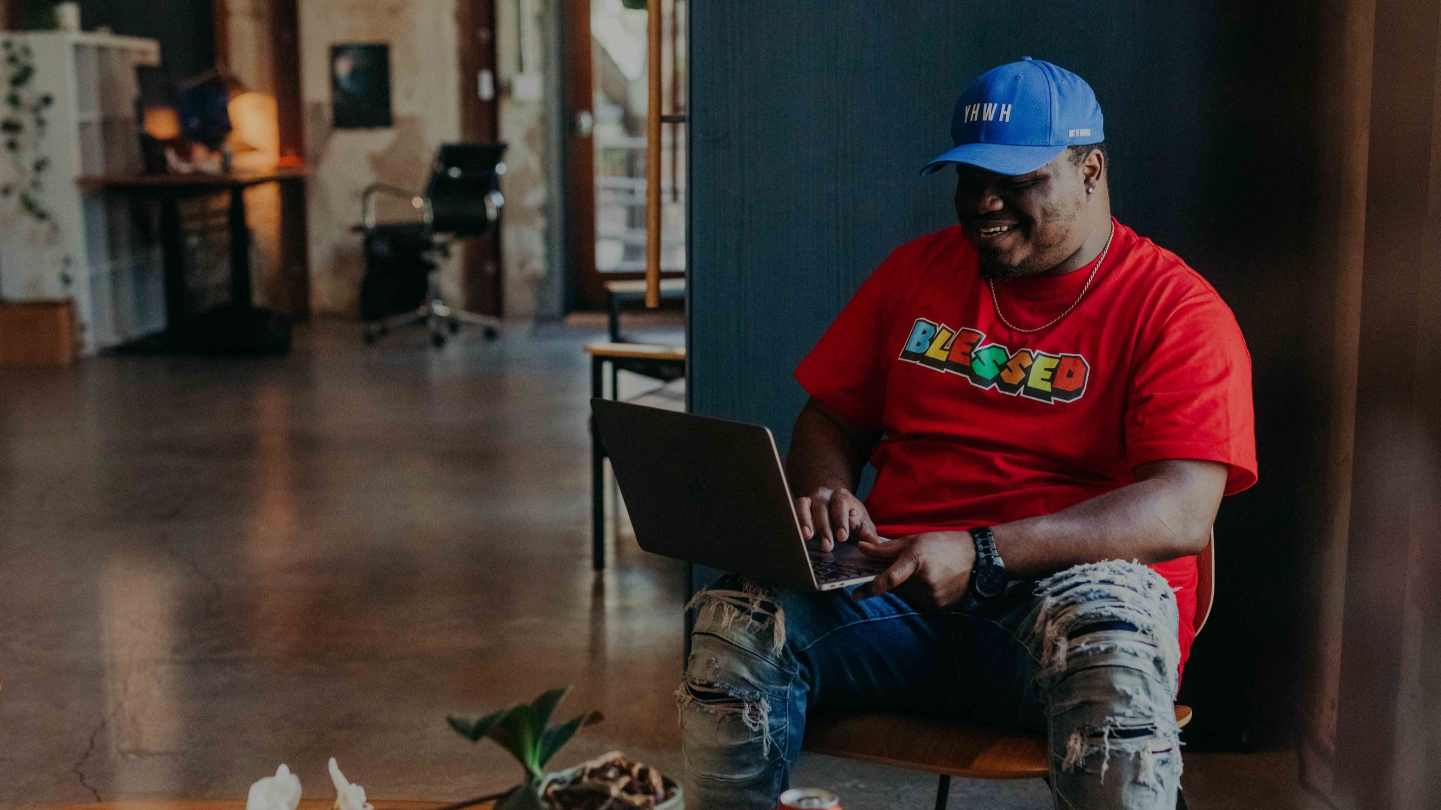 Whiteboard employee Dennis Rivers works on a laptop.