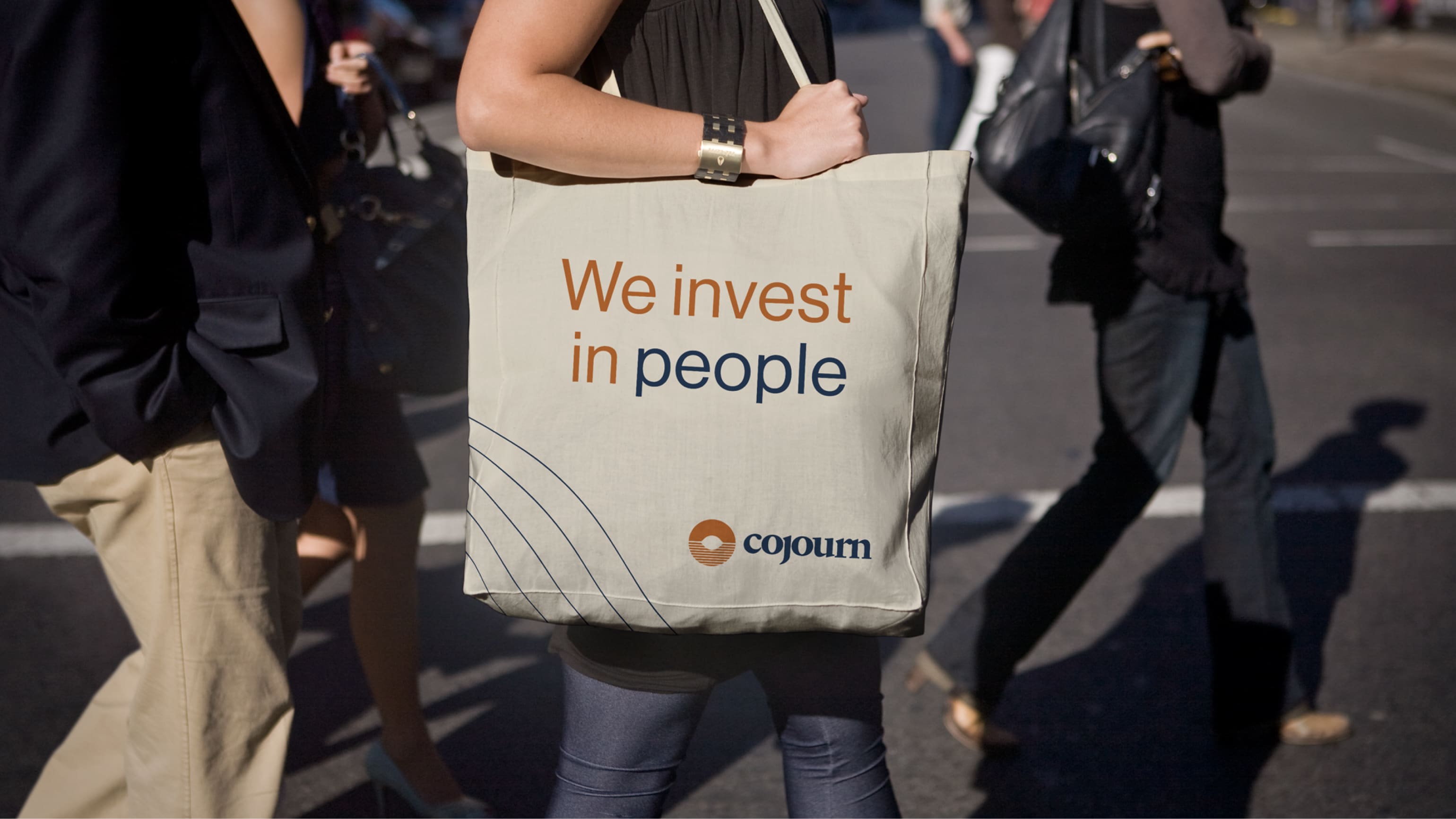 Mockup showing the Cojourn logo on a tote bag.