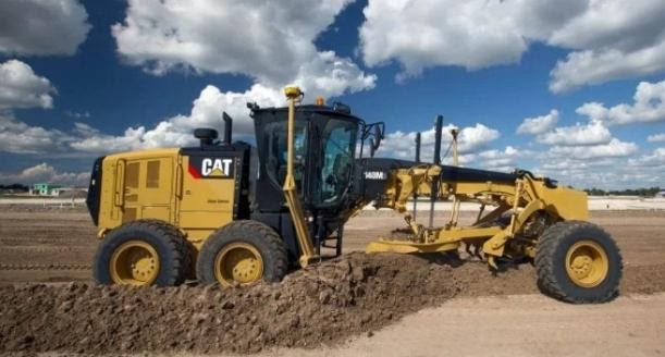 cat grader processing soil