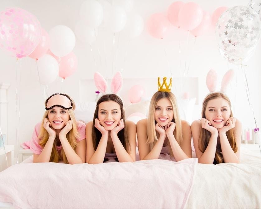 A group of women wearing bunny earsDescription automatically generated with low confidence