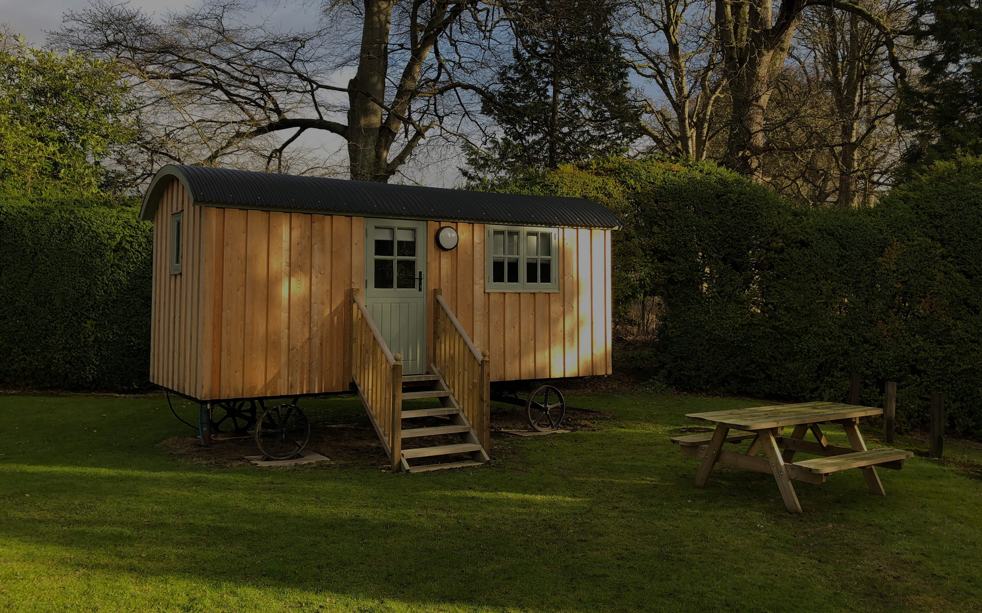 The outside of a newly built wooden shepherds hut.