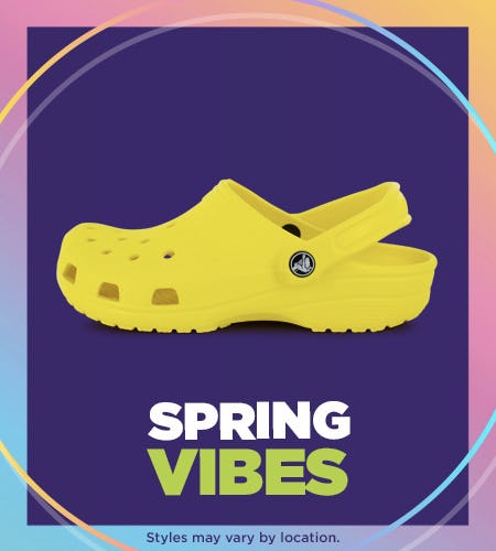 Yellow Crocs with Spring Vibes written below