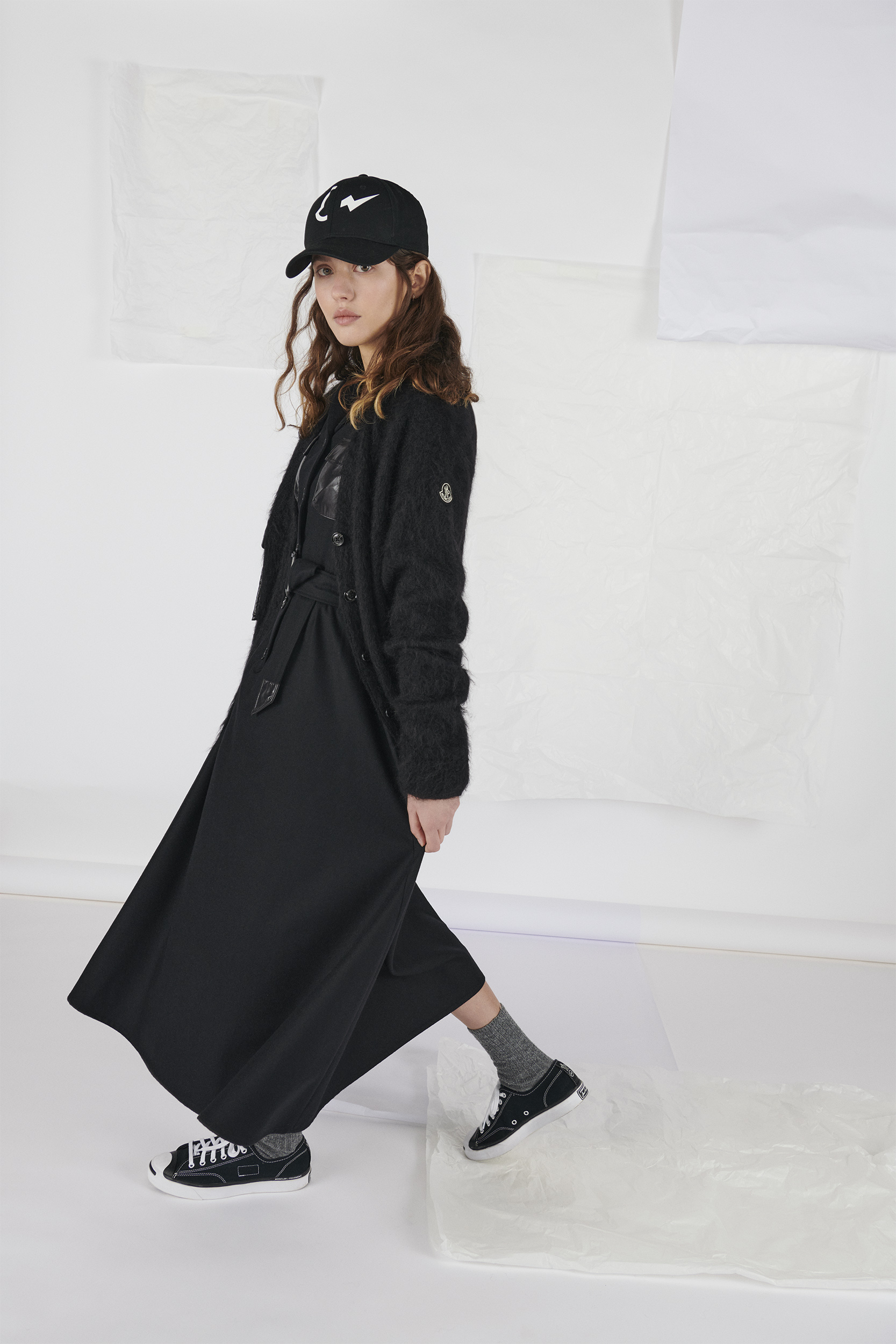 Model wears dress, shoes, jacket and hat by 7 Moncler Frgmt Hiroshi Fujiwara