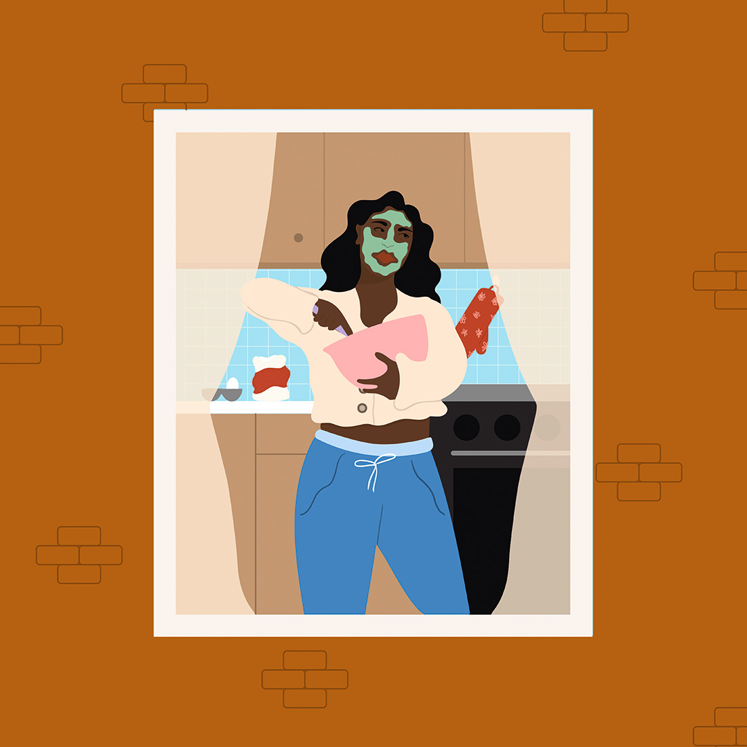 A view of a woman baking in her kitchen through the window of an orange building.