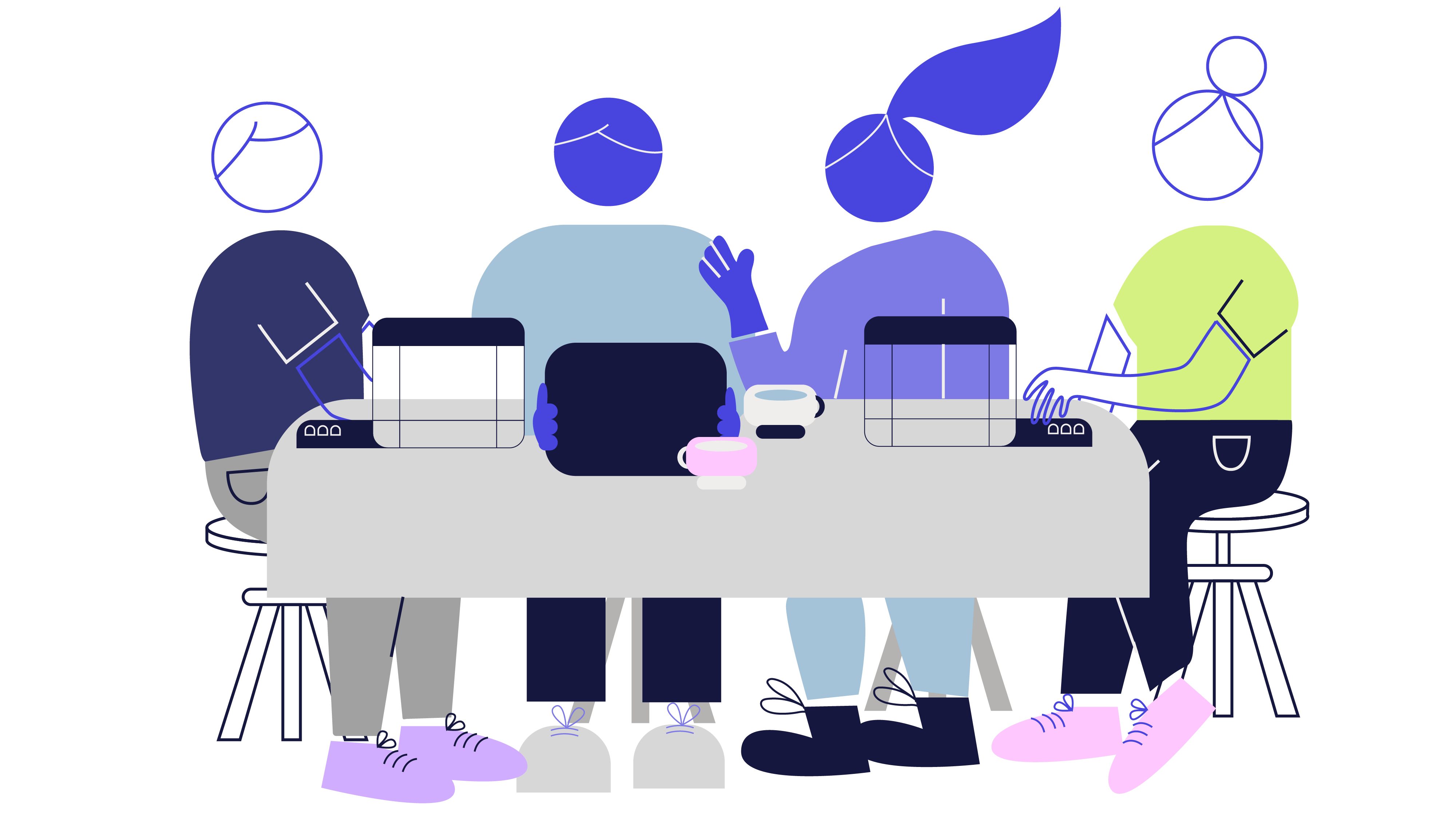 Four employees working and collaborating.
