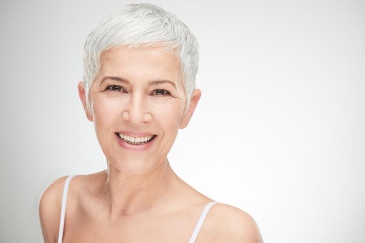 A person smiling for the cameraDescription automatically generated with medium confidence