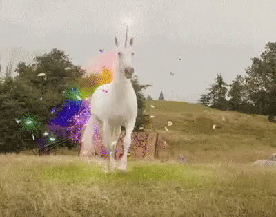 unicorn running hills with rainbow dust coming off of it.