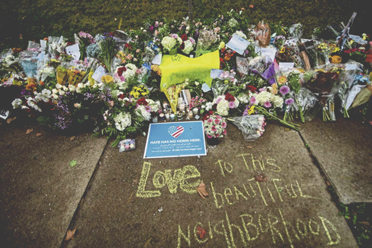 A photo of the flowers, gifts, and other items left at a memorial outside the Tree of Life Synagogue following the terrorist hate attack against Jewish congregants