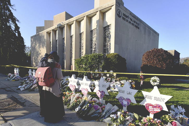 A photo of the flowers, gifts, and other items left at a memorial outside the Tree of Life Synagogue following the terrorist hate attack against Jewish congregants