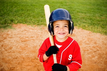 Kid ready to play baseball with a bat
